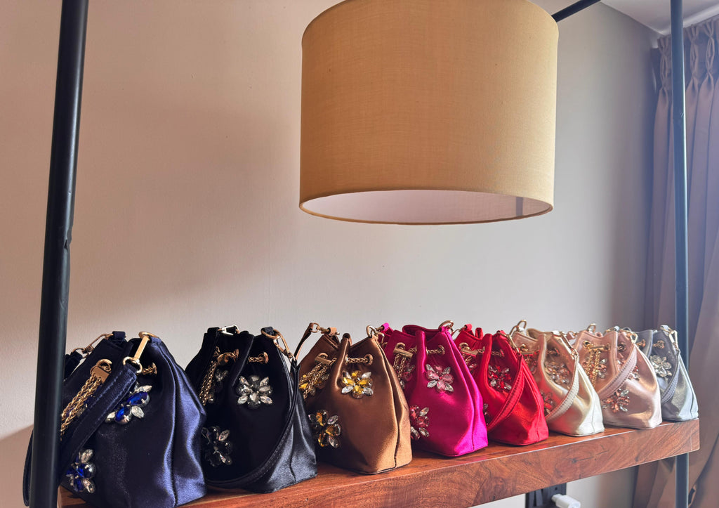 Embellished Satin Potli Bags with Crystal Floral Work